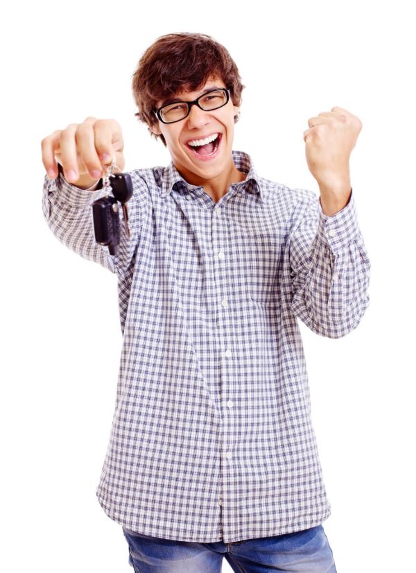 Happy student holding a car key